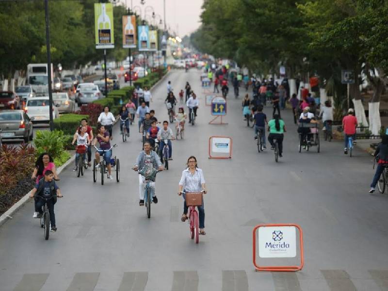 Cyclists and walkers enjoying La Biciruta on Paseo de Montejo in Mérida, Mexico on a car-free Sunday morning