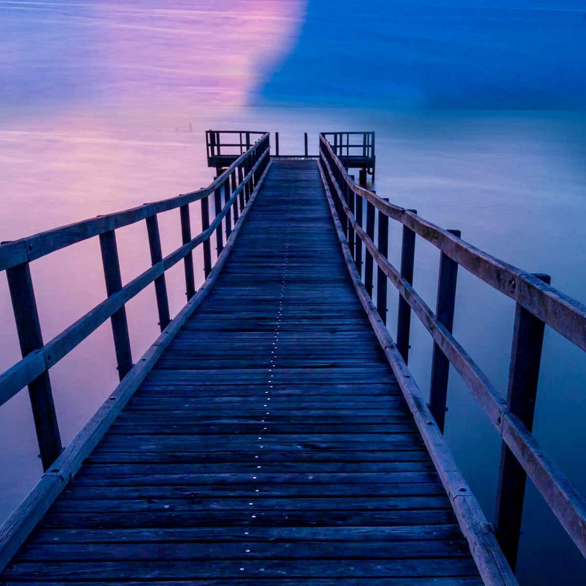 brown wooden dock on sea during daytime